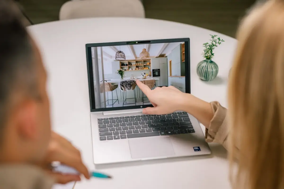 Looking at property photos together on a laptop